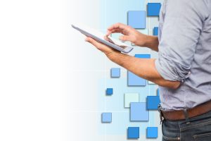 businessman using his tablet with background blue tones
